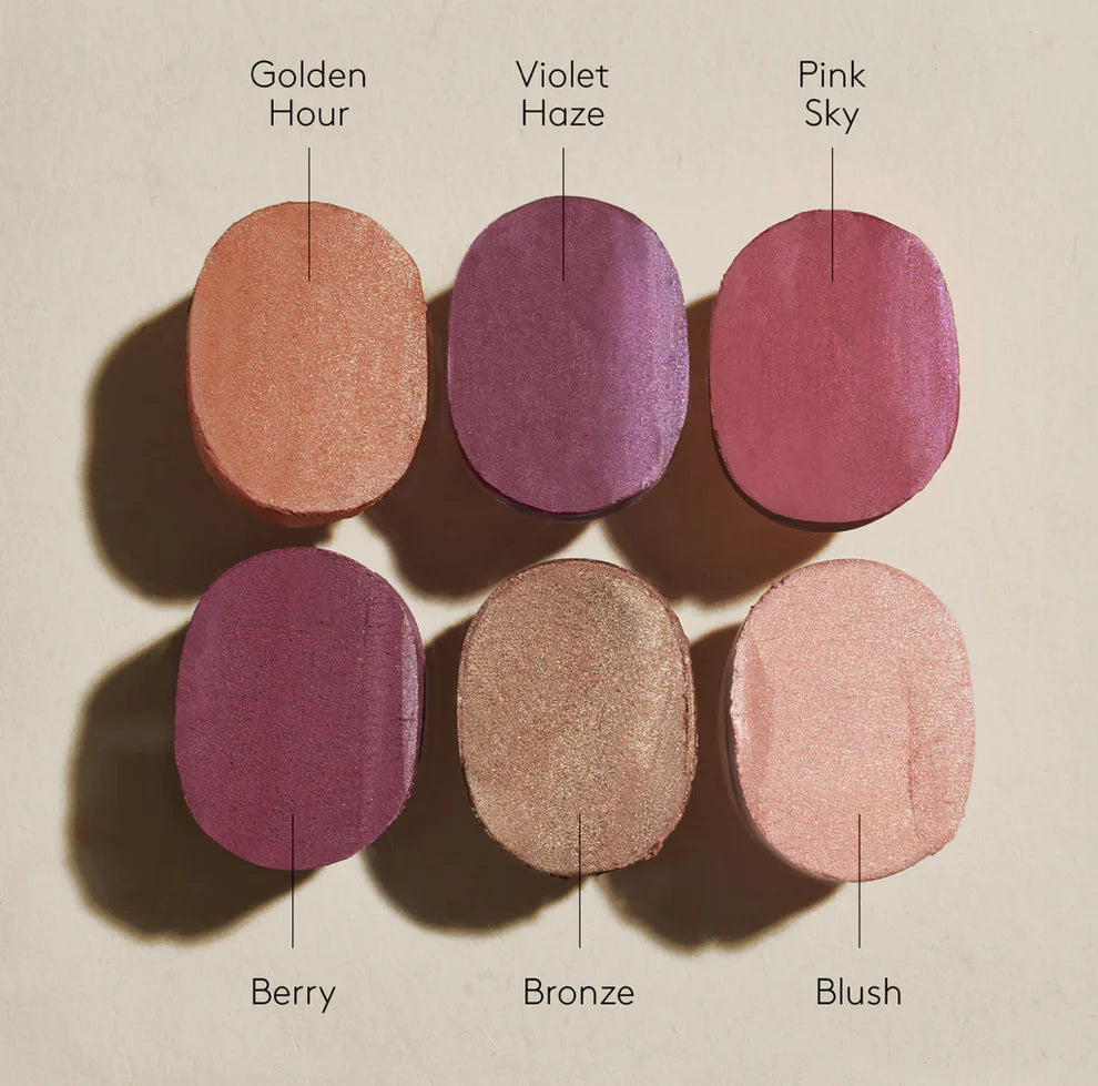Six makeup shades labeled 'Golden Hour', 'Violet Haze', 'Pink Sky', 'Berry', 'Bronze', and 'Blush' on a neutral background.