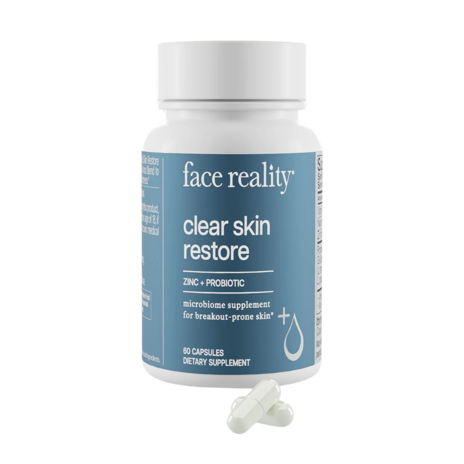 A bottle of 'Clear Skin Restore' supplement by Face Reality, which contains zinc and probiotics for break-prone skin, with 60 capsules inside.
