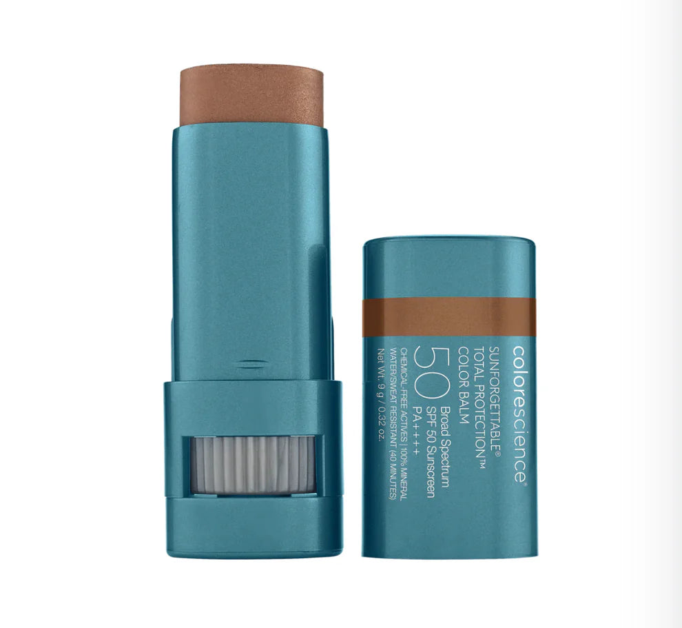 A stick of Sunforgettable Total Protection Color Balm SPF 50 with the cap off, showing the balm stick with a raspberry color shade.