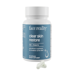 A bottle of 'Clear Skin Restore' supplement by Face Reality, which contains zinc and probiotics for break-prone skin, with 60 capsules inside.