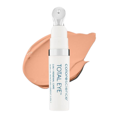 A pump bottle of Total Eye 3-in-1 Renewal Therapy SPF 35 with a swatch of the beige-colored cream next to it.